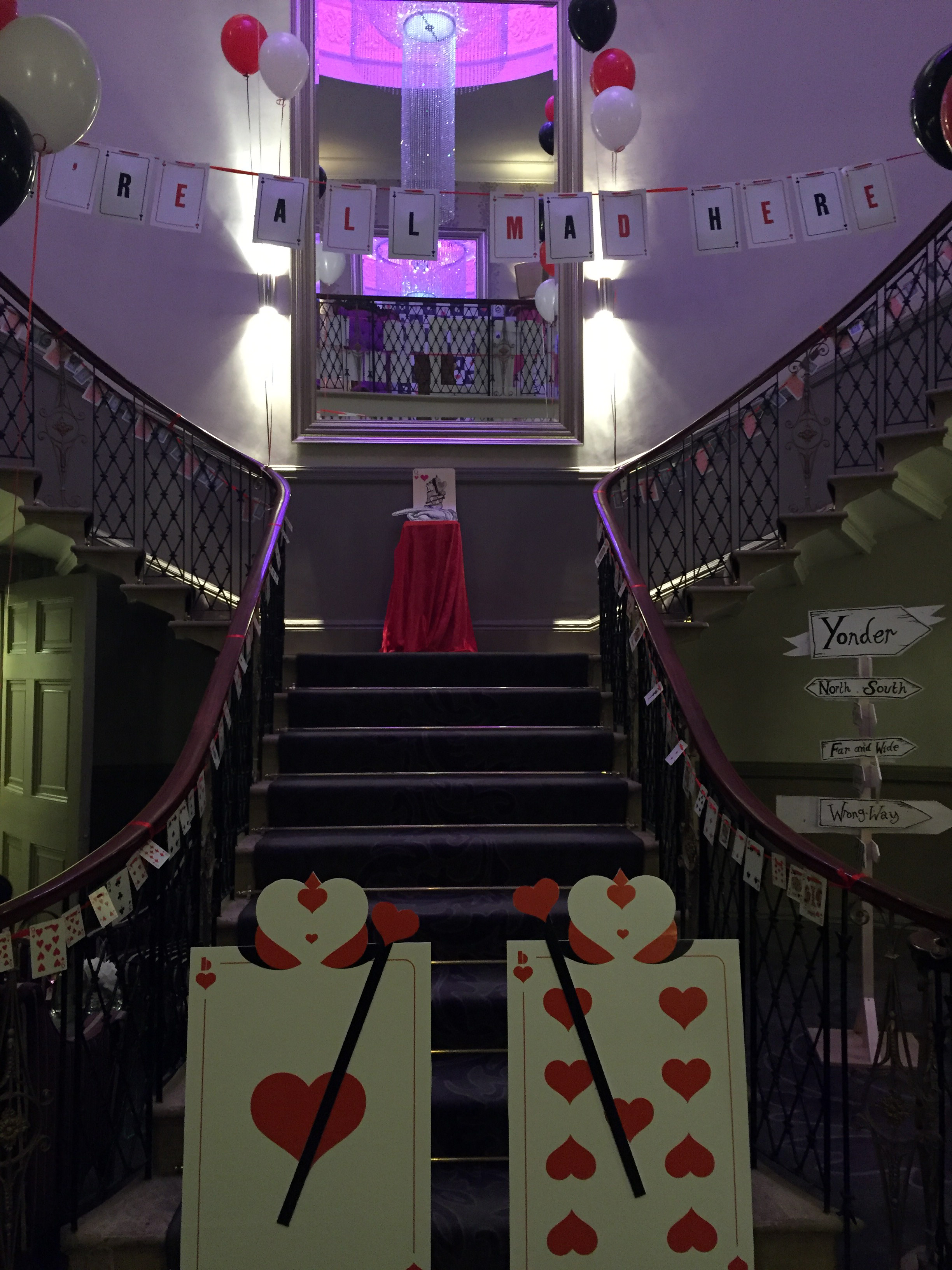 The grand staircase dressed with Alice in Wonderland props