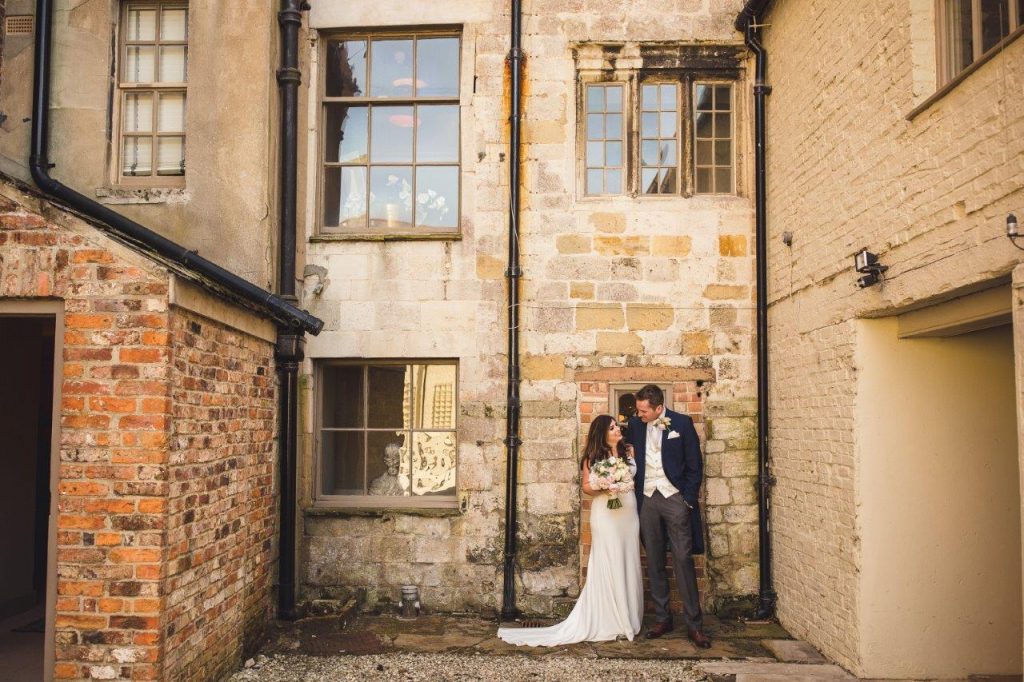 Becca & James in the courtyard at Howsham Hall